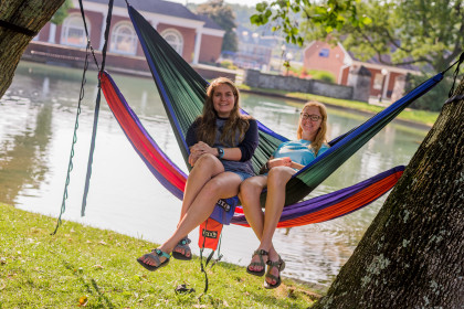 Two students in hammocks near the Duck Pond.
