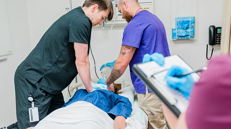 Students practicing in the simulation lab