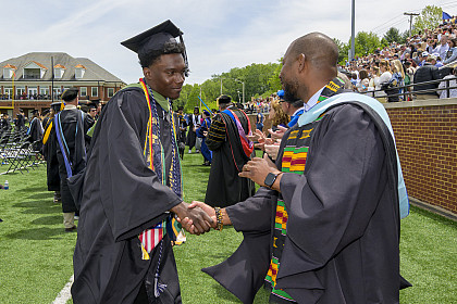 Graduate shaking hand with Dean of Students