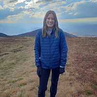 Madison Reeser stands at the top of Whitetop Mountain.