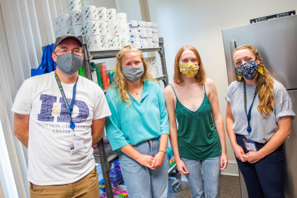 Staff and students work hand in hand to organize donations in the Stinger's Supply Shelf.