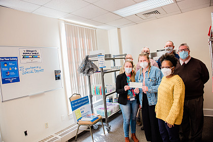 Reception of check in honor of stinger supply shelf