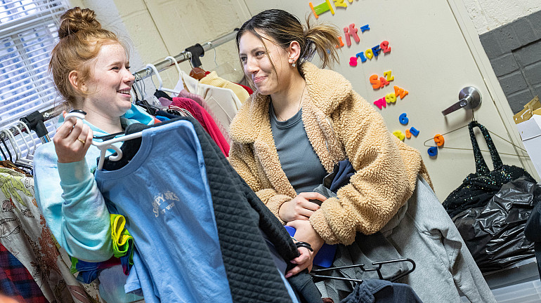 Two students shop for used clothes at the Emory & Henry Thrift Store.