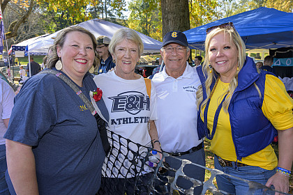 A group of alumni pose for a photo