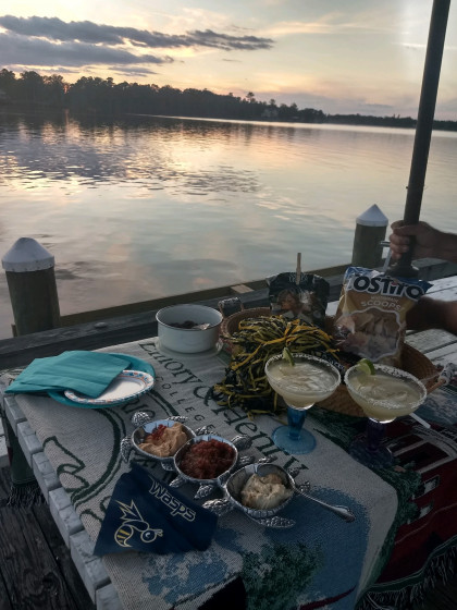 From Laura Craven Duncan '84, Hertford, NC: Our romantic little tailgate for 2 ended with a beautiful sunset over the Albemarle sound. Su...