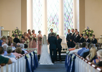 The beautiful stained glass window in the Memorial Chapel is the perfect back ground for photographs of your special day.