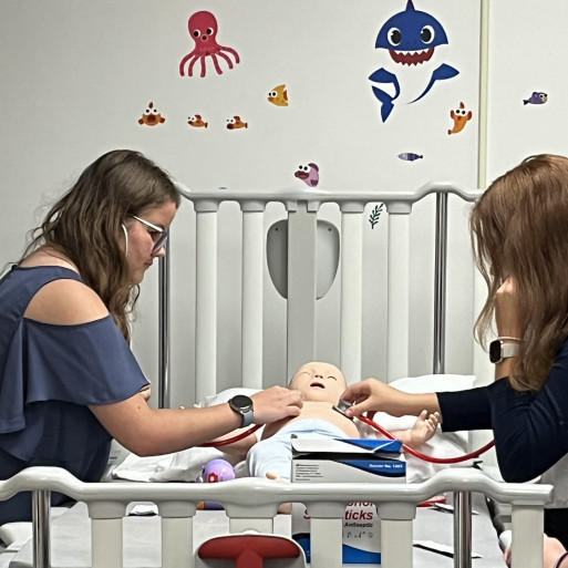 health camp peds lab 2022 Students practice auscultation in the simulation lab.