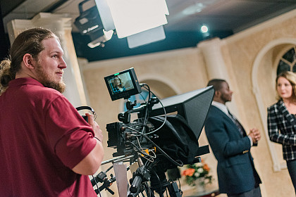 Student filming a news show