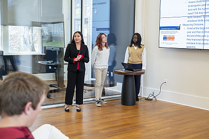 Three students giving a presentation