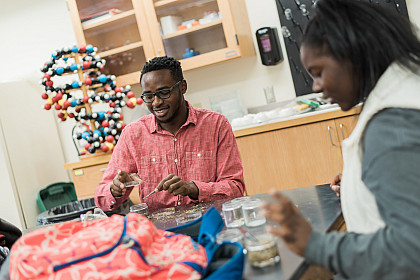 Two students work on a biology assignment in class
