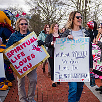 Emory & Henry faculty and staff spread the love with a walk on campus to Van Dyke.