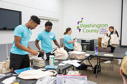 Students cleaning in the library