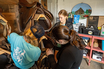 Student working in a barn
