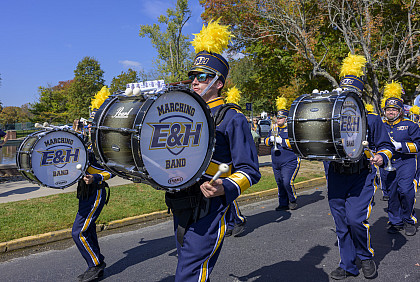 E&H Marching Band walking down route playing drums