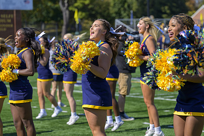 A group of cheerleaders jumping with excitement