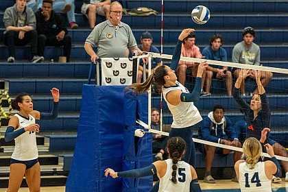 E&H students playing in a volleyball match