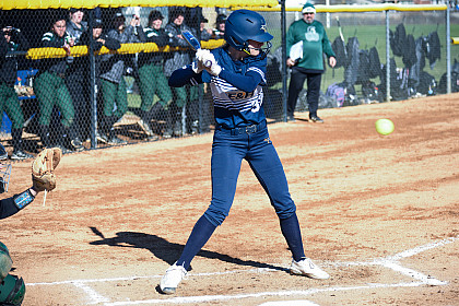 E&H students playing in a softball match